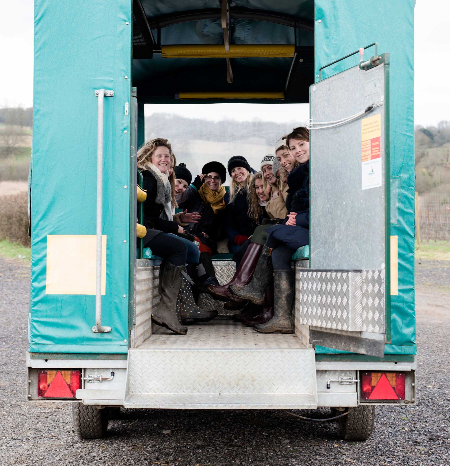People in the back of a trailer
