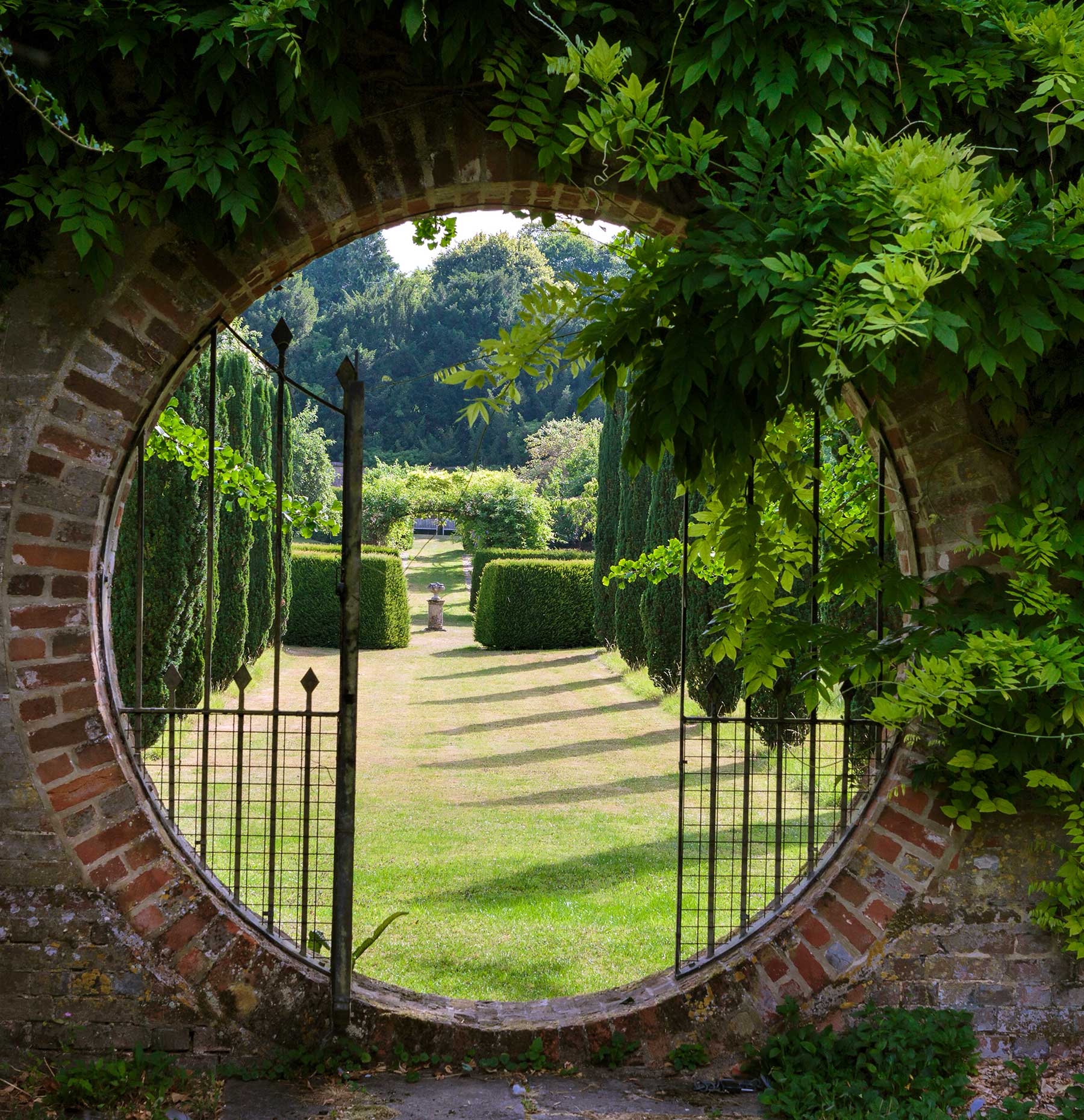 looking through the moon gate into the walled garden